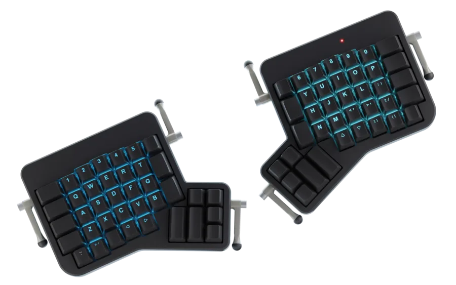 ErgoDox EZ Glow split keyboard, tented, with cyan backlighting.