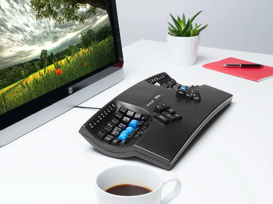 Kinesis Advantage2 contoured keyboard with blue home-row keycaps.